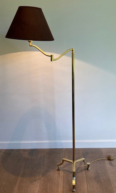 Brass reading lamp with removable, height-adjustable arm.