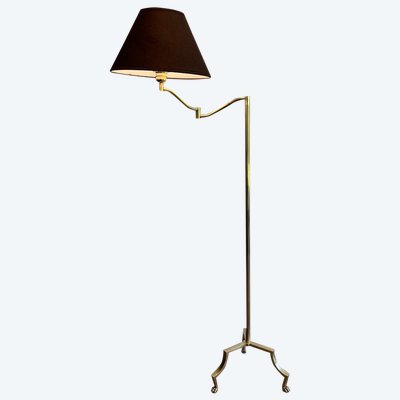 Brass reading lamp with removable, height-adjustable arm.