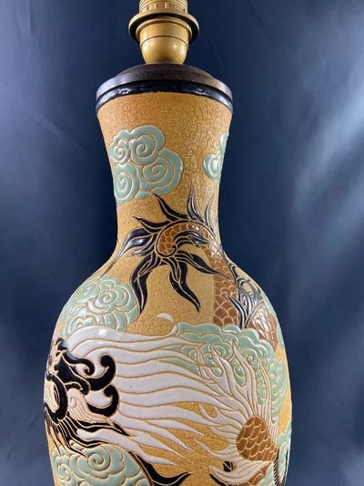 Very large BIEN HOA stoneware dragon lamp on yellow background Vietnam
