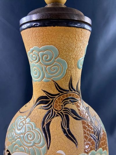 Very large BIEN HOA stoneware dragon lamp on yellow background Vietnam