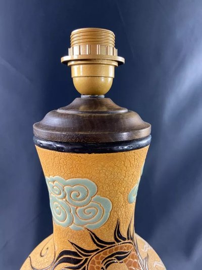 Very large BIEN HOA stoneware dragon lamp on yellow background Vietnam
