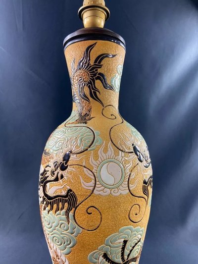 Very large BIEN HOA stoneware dragon lamp on yellow background Vietnam