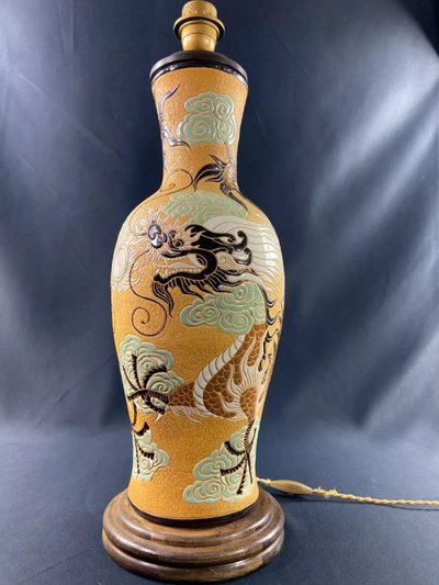 Very large BIEN HOA stoneware dragon lamp on yellow background Vietnam