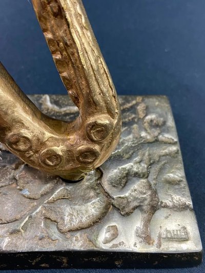 Carved saxophone subject in bronze signed Yves Lohé