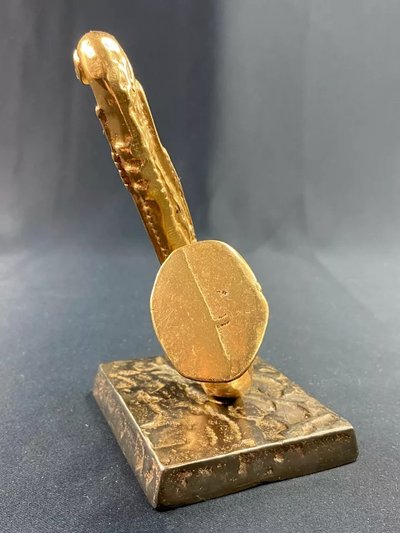 Carved saxophone subject in bronze signed Yves Lohé