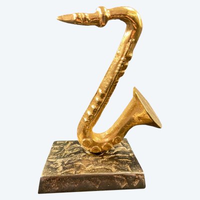 Carved saxophone subject in bronze signed Yves Lohé
