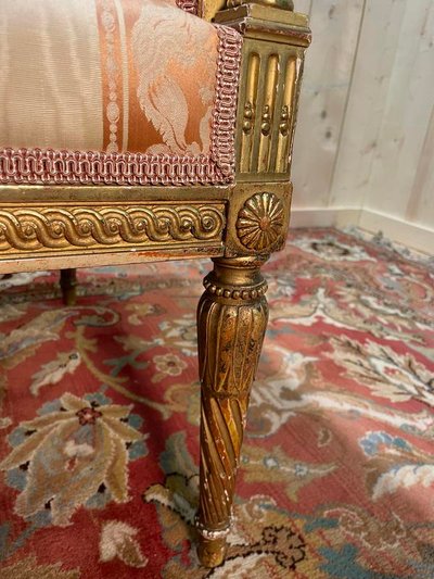 Louis XVI style bench in gilded wood.