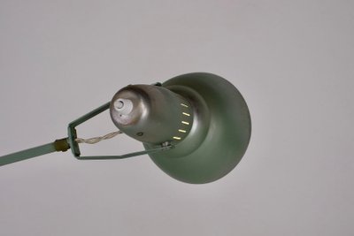 Workshop lamp with pendulum.
