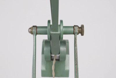 Workshop lamp with pendulum.