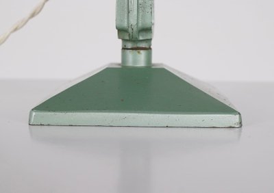 Workshop lamp with pendulum.