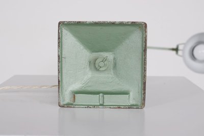 Workshop lamp with pendulum.