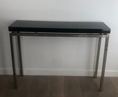 Chromed console with thick black lacquered top. French work. Circa 1970