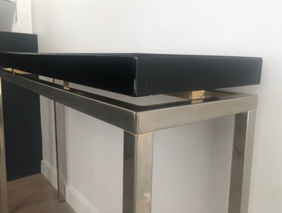 Chromed console with thick black lacquered top. French work. Circa 1970