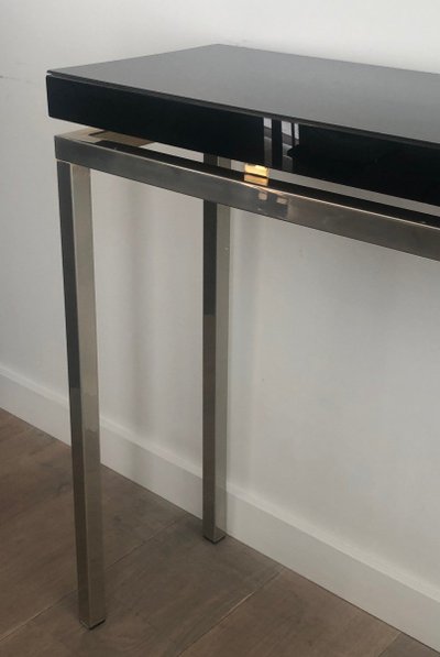 Chromed console with thick black lacquered top. French work. Circa 1970