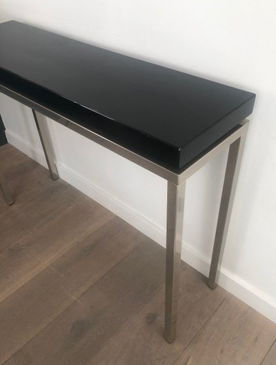 Chromed console with thick black lacquered top. French work. Circa 1970