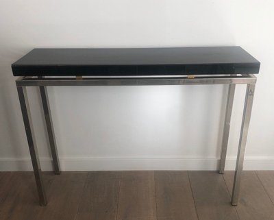 Chromed console with thick black lacquered top. French work. Circa 1970