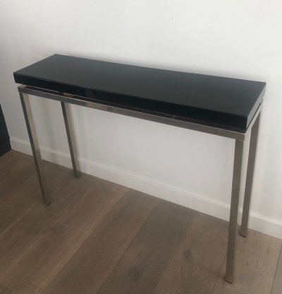 Chromed console with thick black lacquered top. French work. Circa 1970