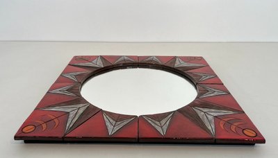 Ceramic Mirror Depicting a Stylized Sun on a Red Background Attributed to Oswal Tiberghien