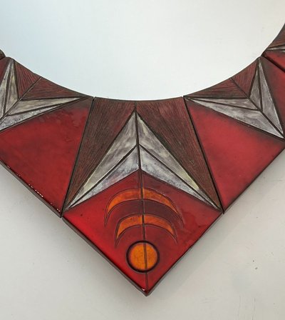Ceramic Mirror Depicting a Stylized Sun on a Red Background Attributed to Oswal Tiberghien