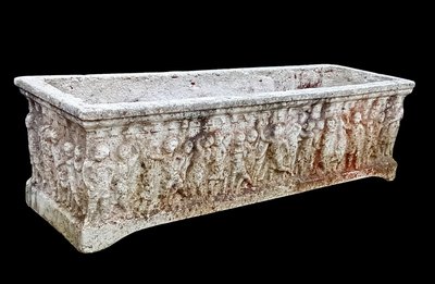 Old planter with character decoration