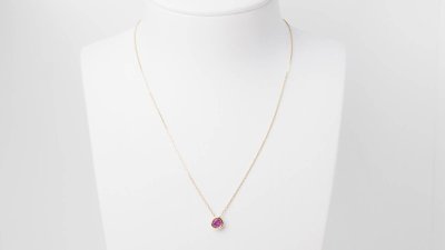 Yellow gold and ruby solitaire necklace