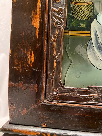 Chine début XXe, buffet bas en enfilade ouvrant à quatre portes ornées de fixés sous verre