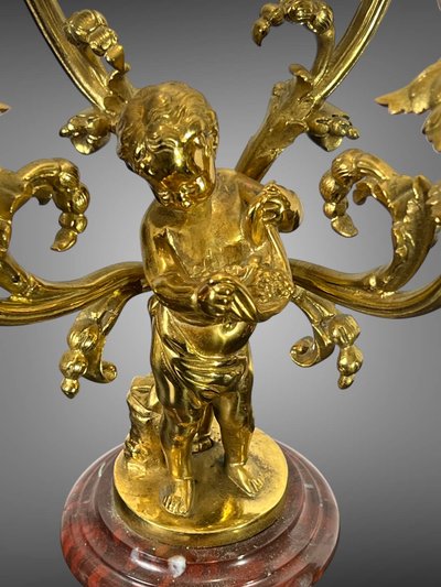 PAIR OF 4-LIGHT GILT BRONZE CANDELABRA ON A GRIOTTE MARBLE BASE