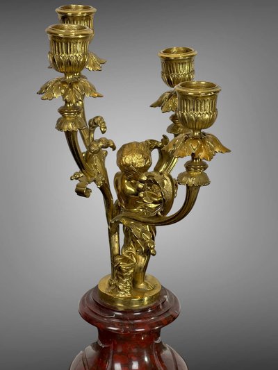 PAIR OF 4-LIGHT GILT BRONZE CANDELABRA ON A GRIOTTE MARBLE BASE