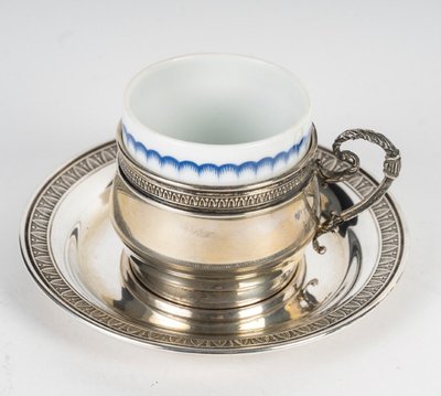 A Series Of Porcelain And Solid Silver Cups