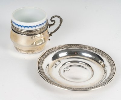 A Series Of Porcelain And Solid Silver Cups