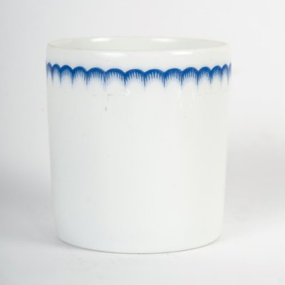 A Series Of Porcelain And Solid Silver Cups