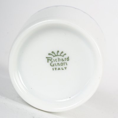 A Series Of Porcelain And Solid Silver Cups