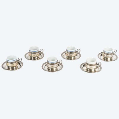 A Series Of Porcelain And Solid Silver Cups
