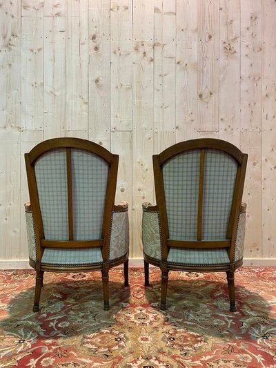 Paire de fauteuils bergères de style Louis XVI