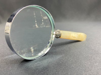 Magnifying glass with mother-of-pearl handle and silver ferrule