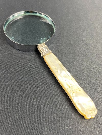 Magnifying glass with mother-of-pearl handle and silver ferrule