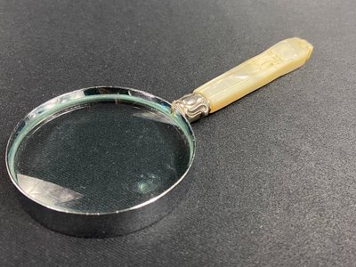 Magnifying glass with mother-of-pearl handle and silver ferrule