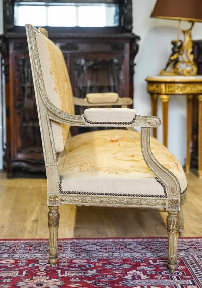 A large Aubusson sofa in carved, lacquered and gilded wood, late 19th century