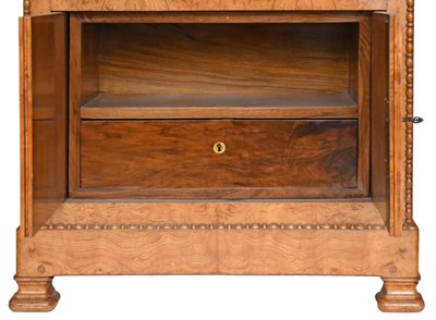 Secrétaire en placage de bois de loupe d'époque Restauration