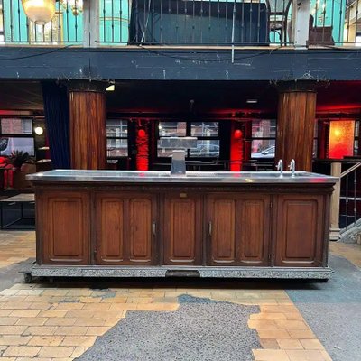 Bancone bar in rovere con piano in acciaio inox