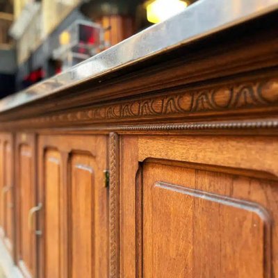 Bancone bar in rovere con piano in acciaio inox