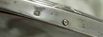 Petit miroir ovale biseauté avec monture en argent massif vers 1900