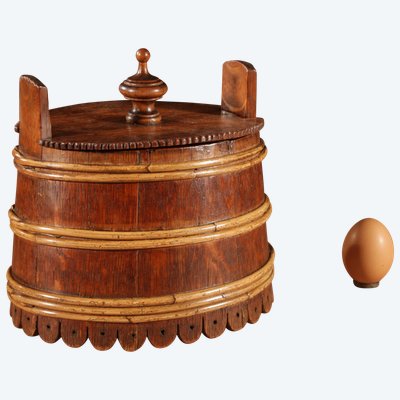 An oval oak butter pot.