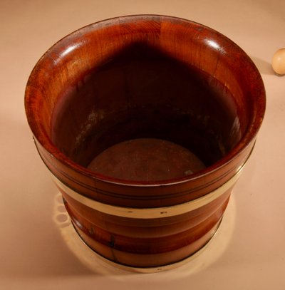 A large Dutch brass and turned teak planter/wine cooler, circa 1900