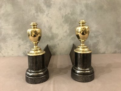 Pair of antique cast iron and brass andirons from the 19th century