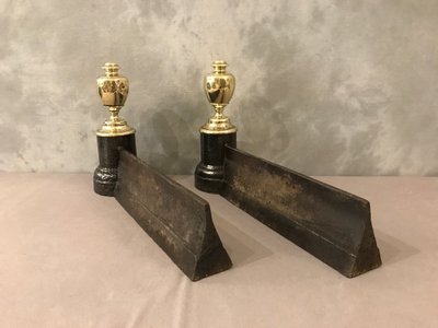 Pair of antique cast iron and brass andirons from the 19th century
