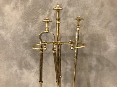 Antique fireplace set in polished and varnished brass from the 19th century