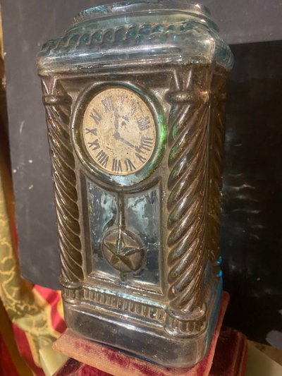 Rare molded glass bottle in imitation of a clock enhanced with painting, Napoleon III period