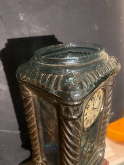 Rare molded glass bottle in imitation of a clock enhanced with painting, Napoleon III period