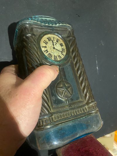 Rare molded glass bottle in imitation of a clock enhanced with painting, Napoleon III period
